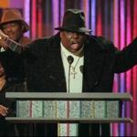 FILE--Notorious B.I.G., winner of rap artist and rap single of the year, clutches his awards at the podium during the annual Billboard Music Awards in New York Wednesday evening, Dec. 6, 1995. The rapper, whose real name was Christopher Wallace, was gunned down in Los Angeles as he left a party early Sunday, March 9, 1997, police said. Wallace, 24, was reportedly attending a party at the Petersen Automotive Museum in celebration of Friday s 11th Annual Soul Train Music Awards. (AP Photo/Mark Lennihan, File) -- Library Tag 03032002 Arts & Entertainment -- Library Tag 09072002 National-Foreign Library Tag 07212005 Living/Arts